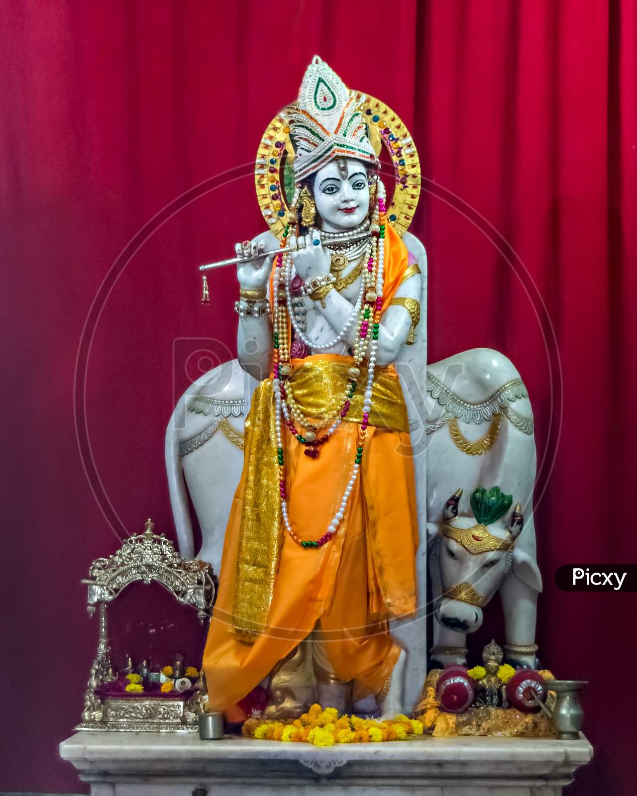Nicely Carved And Decorated Isolated Idol Of Hindu God Krisna With Flute.