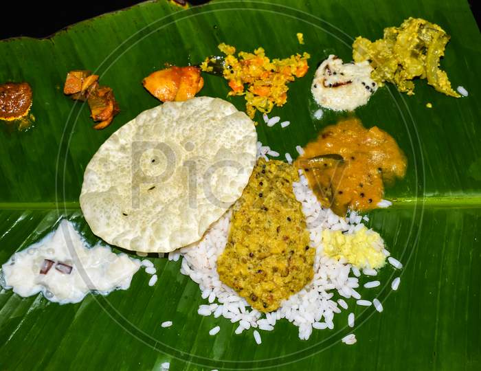 Traditional Onam Sadhya Or Onam Feast. Traditional South Indian Food Served In Banana Leaf.