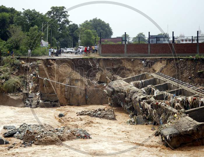 Destroyed bridge over a stream after a heavy rains in the outskirts of Jammu,  26 August 2020.