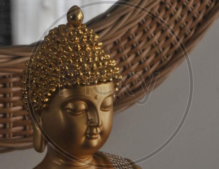 Lord Gautam buddha statue close up photo with attractive background.