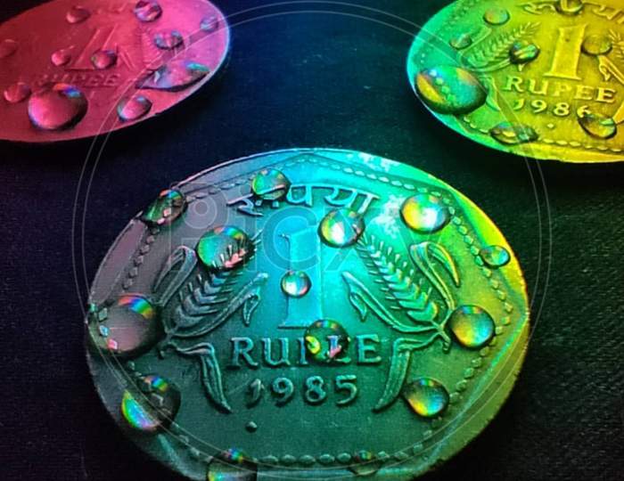 Colorful coin of indian one rupess.