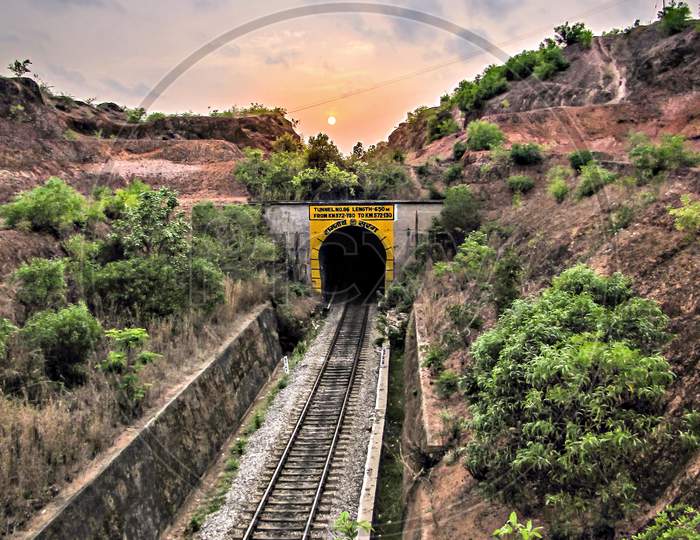 Sunset Over The Railway Line Going Into Tunnel At Honavar, Karnataka.