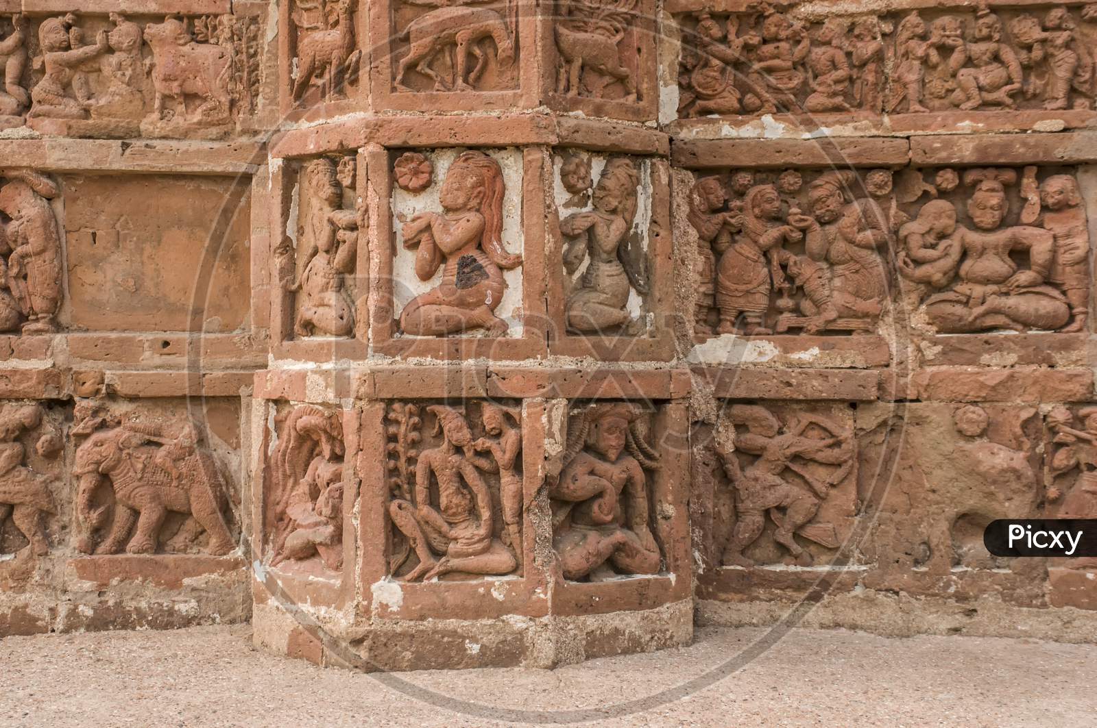 The terracotta work in a wall of a temple.