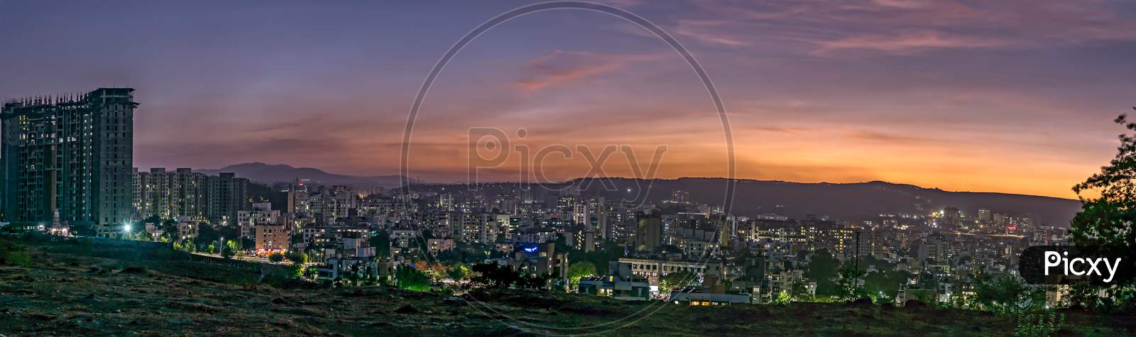 Panorama Image Of Beautiful Evening Sky In The City With Some Lights In Buildings. Can Be Used As Background.