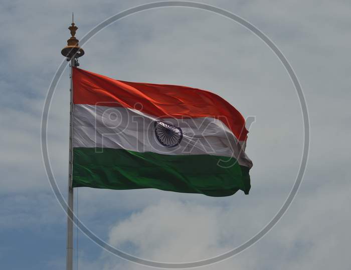 Indian flag to a pole flying in the wind