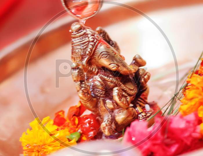 Lord Ganesha  golden murti closeup