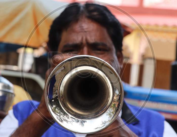 Band Man In Indian Wedding Playing An Instrument