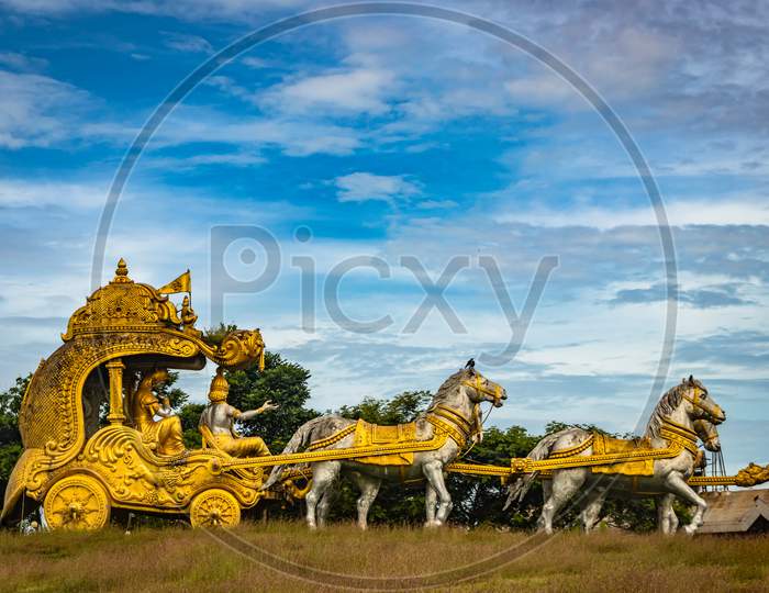 Holly Arjuna Chariot Of Mahabharata In Golden Color With Amazing Sky Background