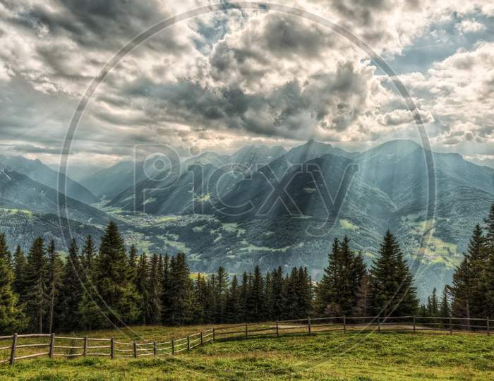 Mountains Austria Alps Rays Of Light Clouds Fence Nature Photo
