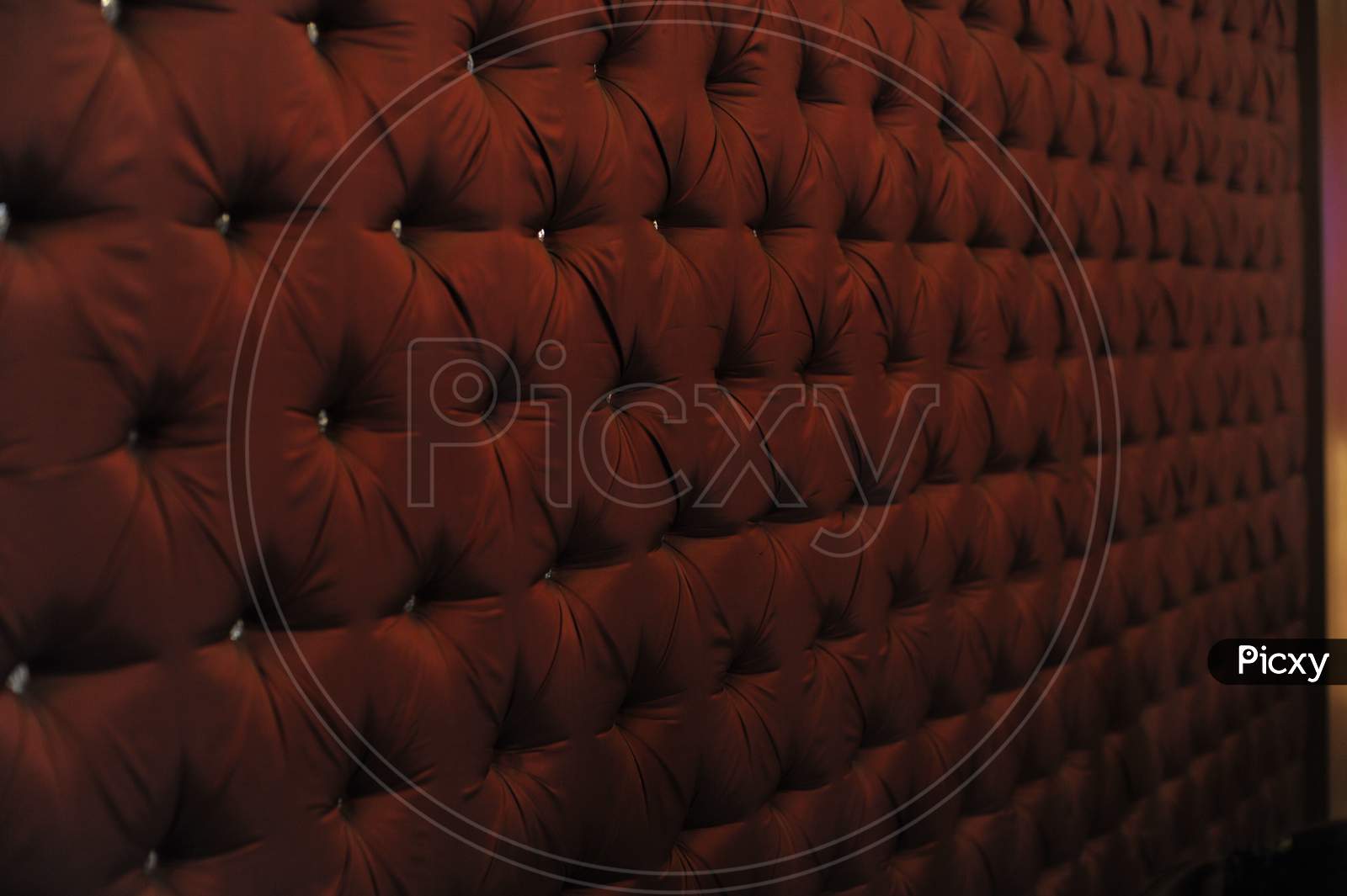 Sofa closeup texture background maroon colour