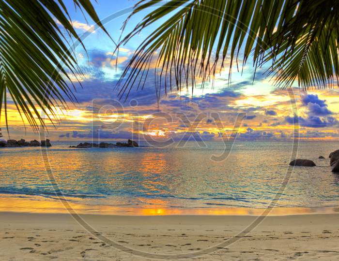 Sea, Beach, Palms With Beautiful Sunrise And Sunset.