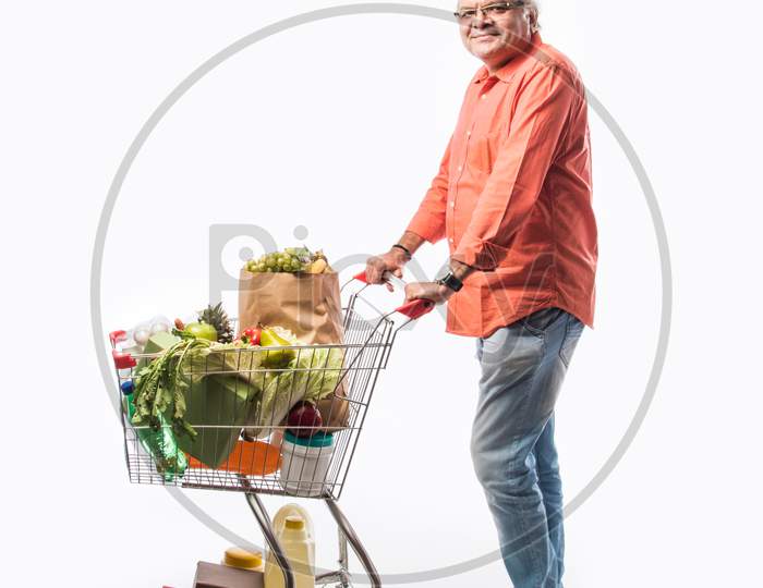 Indian Asian Senior Man With Shopping Trolly Or Cart