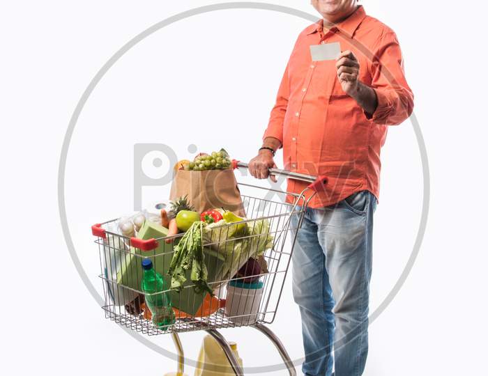 Indian Asian Senior Man With Shopping Trolly Or Cart
