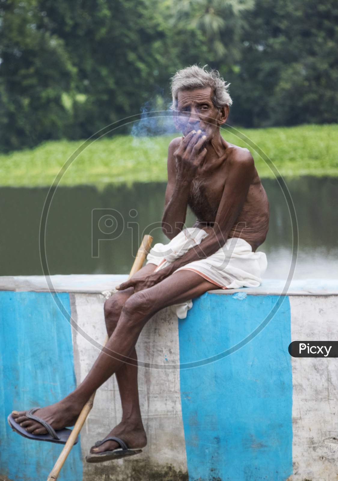 Indian Old Man Smoking