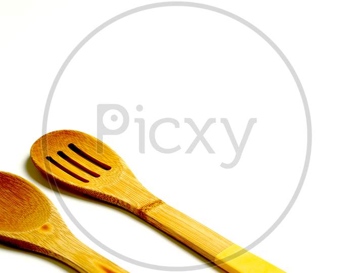 Wooden Spoons On A White Background. Culinary Concept.