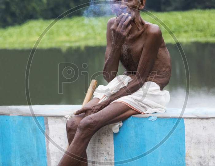 Indian Old Man Smoking