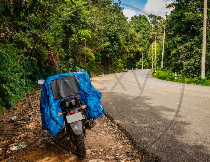 Solo Traveler Loaded Bike With Isolated Road And Amazing Background