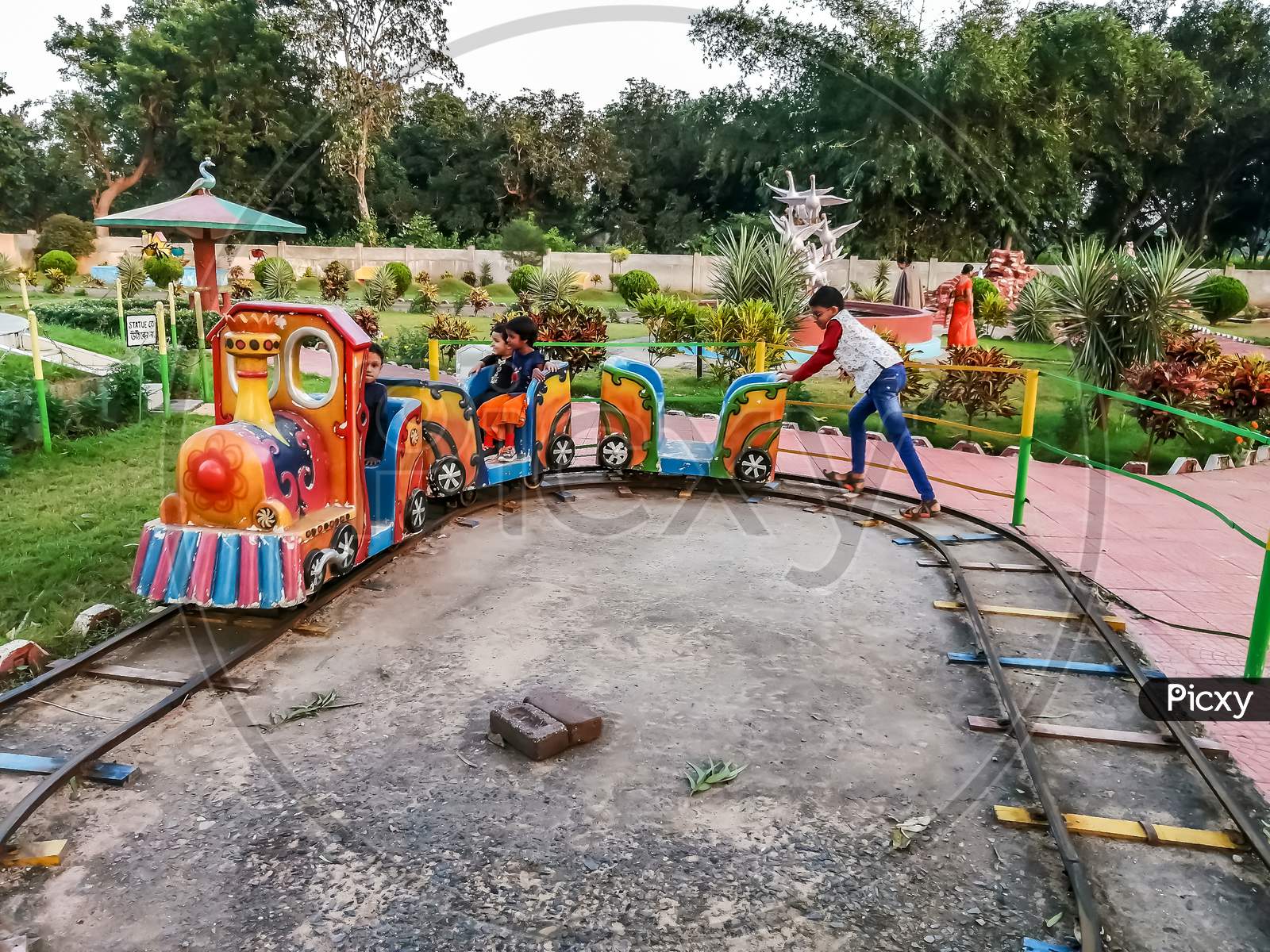 Kids are enjoying a Little toy at a Amusement park