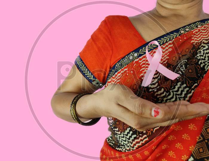 Pink ribbon wear by indian woman an awareness of Cancer
