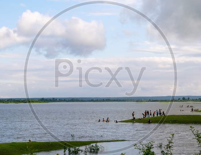 People taking bath in a water reservoir or dam situated at Band Baretha in Bharatpur District Rajasthan