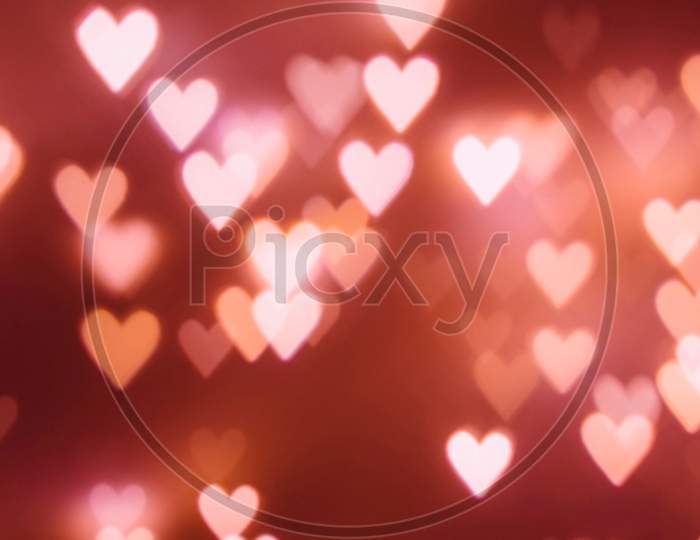 Shiny hearts bokeh light Valentine's day on a dark background.