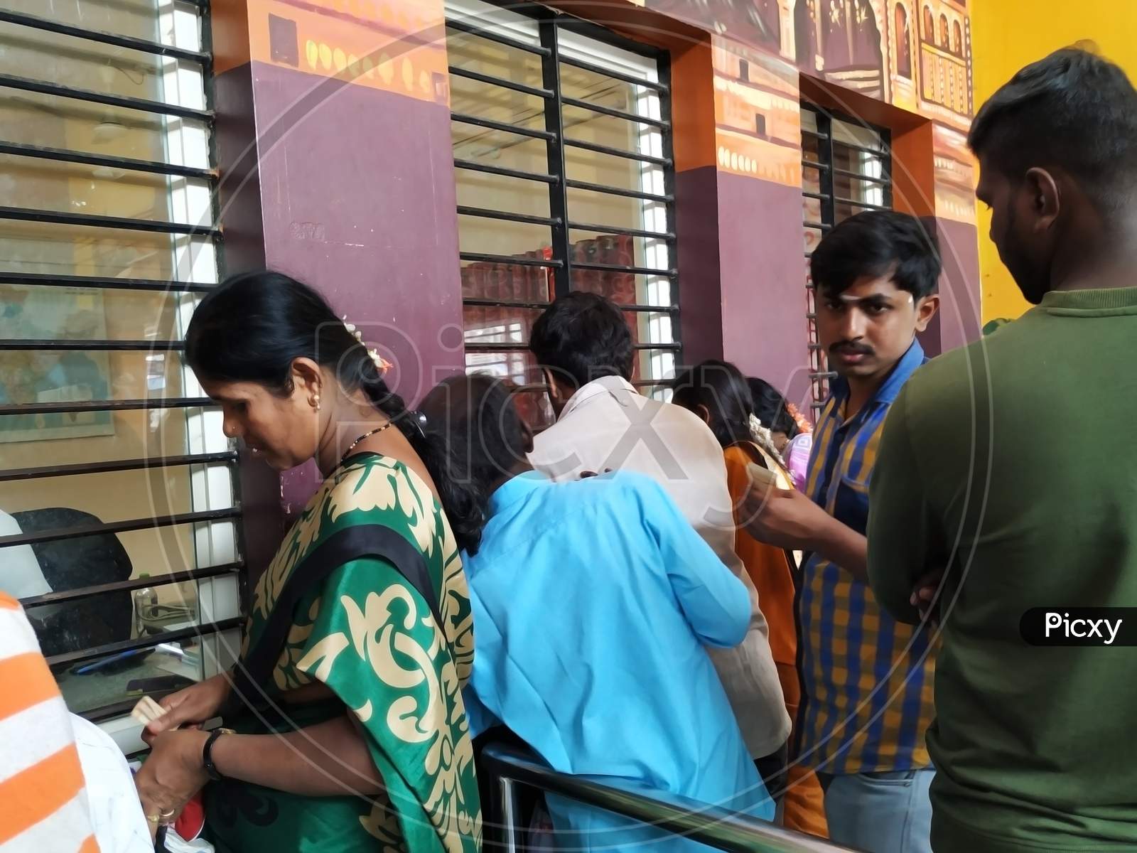 Interior Design Of Pandavapura Railway Station Ticket Counter And People In The Queue To Purchase Ticket