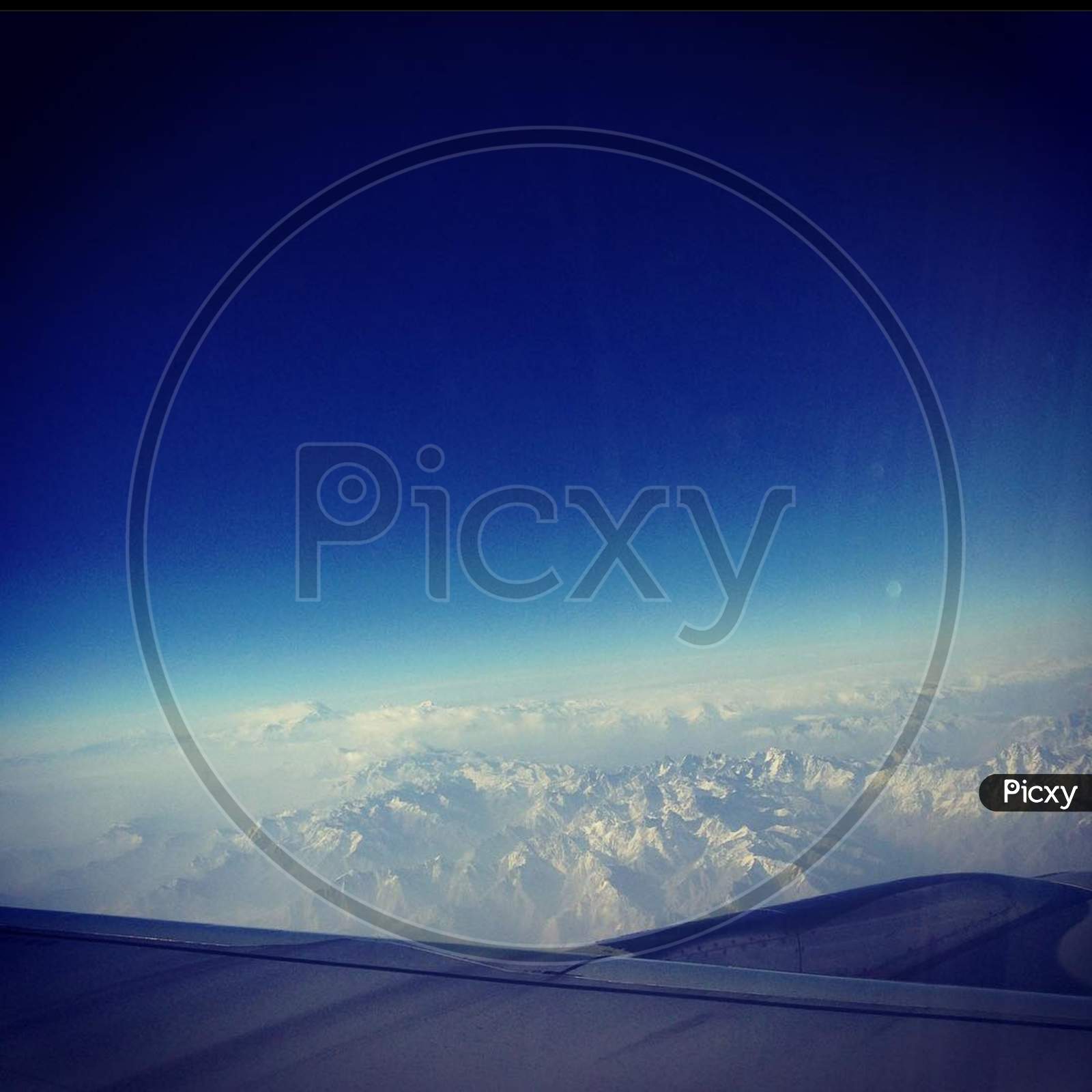 Earth×Remove  Air travel×Remove  Blue×Remove  Sky×Remove  Daytime×Remove  Mountain range×Remove  Horizon×Remove  Cloud×Remove  Atmosphere×Remove  Spac