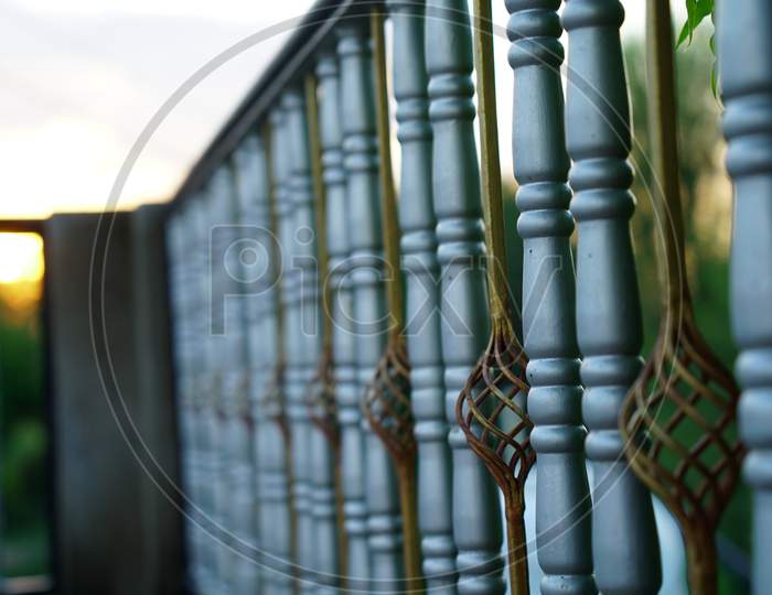 Selective focus on stylish polished iron fence Railing.