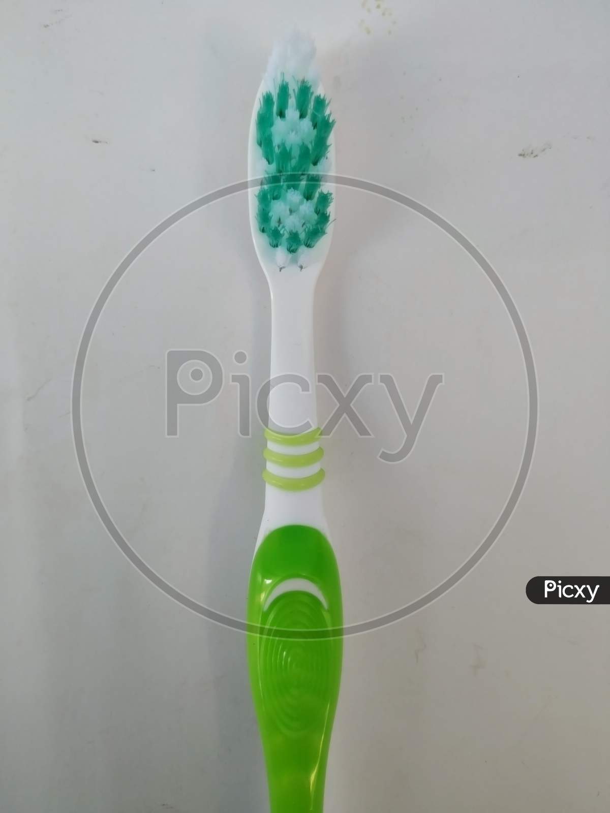 Bangalore, Karnataka/India-Feb 12 2020: Closeup Of New And Unused Green Color Oral-B Plastic Toothbrush Isolated In A White Background