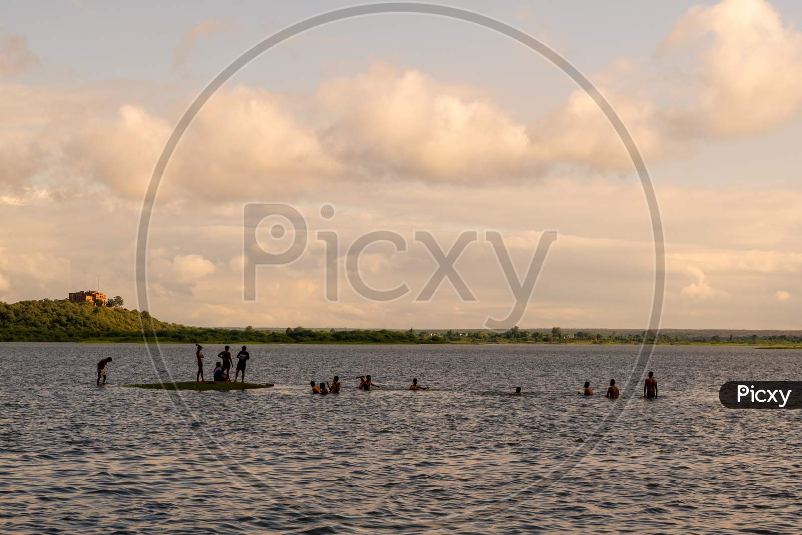 People taking bath in a water reservoir or dam situated at Band Baretha in Bharatpur District Rajasthan