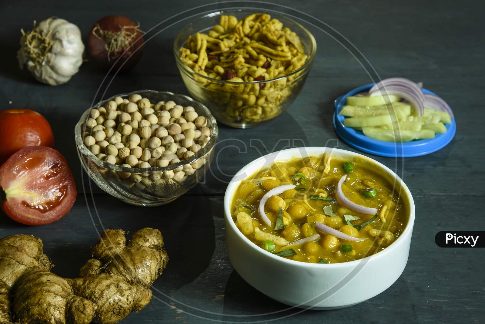 Ghugni, A preparation of Dried peas with Spices,chanachur,Tomatoes,Onions and Green Chilies. It is a famous street food of Eastern India.