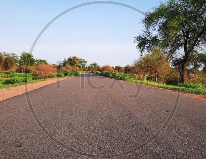 Asphalt Road In Rural Area Of India With Grunge On Edges Closeup