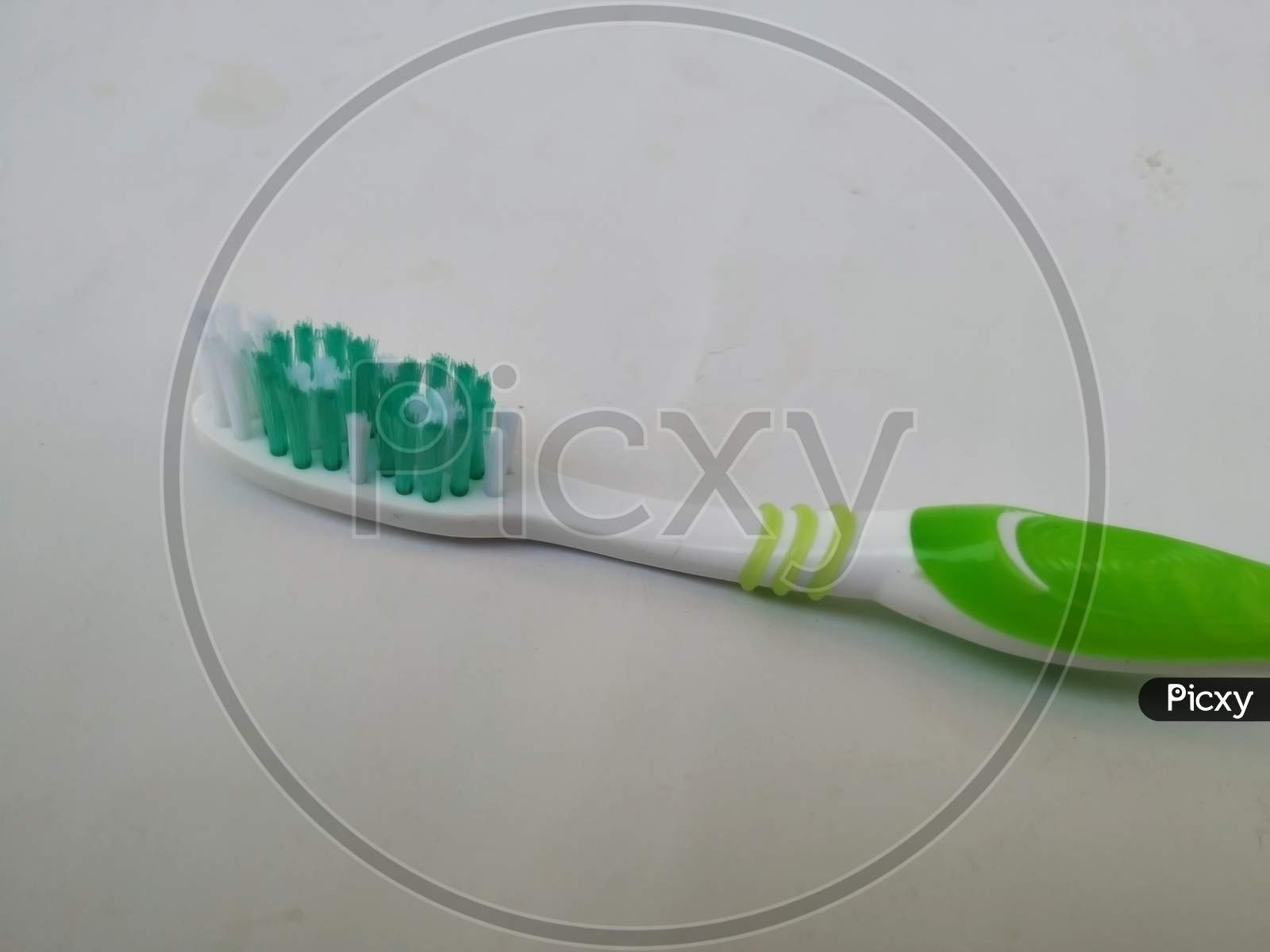 Bangalore, Karnataka/India-Feb 12 2020: Closeup Of New And Unused Green Color Oral-B Plastic Toothbrush Isolated In A White Background