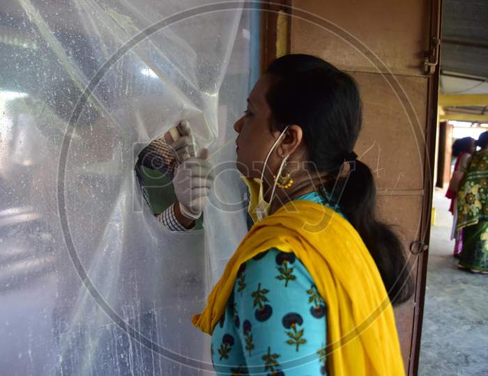 A woman gives a swab sample for Covid-19 test in Nagaon district of Assam on August 26,2020.