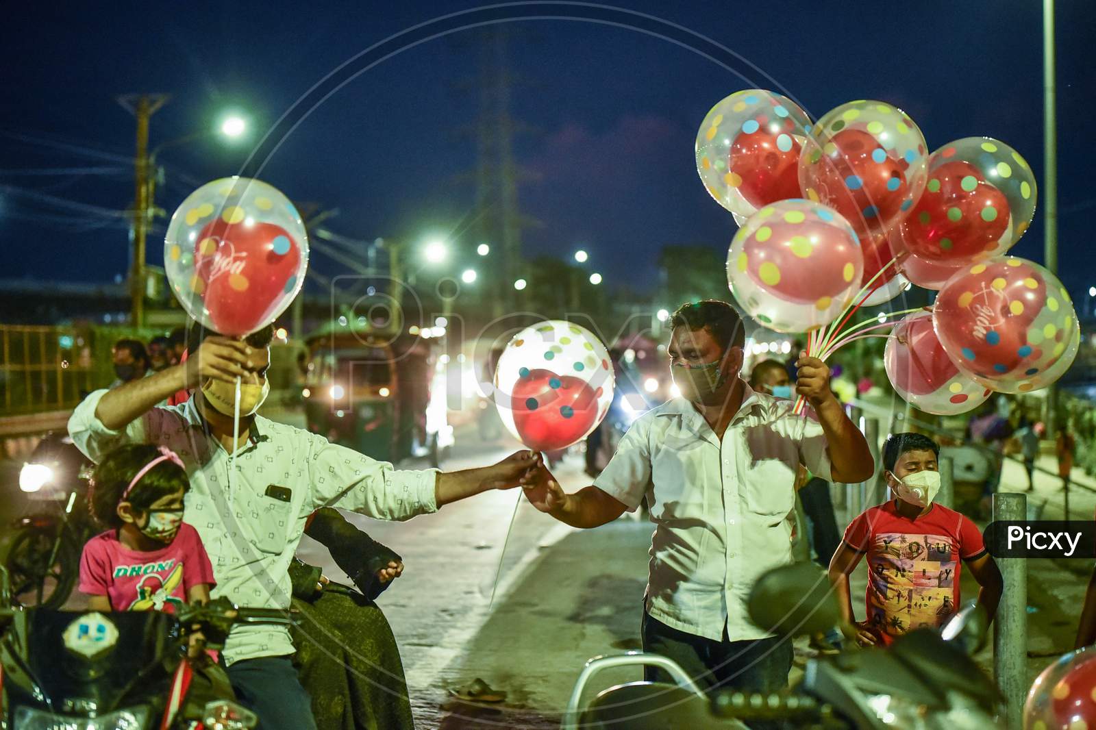 A Man Sells Balloons At At Prakasam Barrage, In Vijayawada On August 24, 2020.