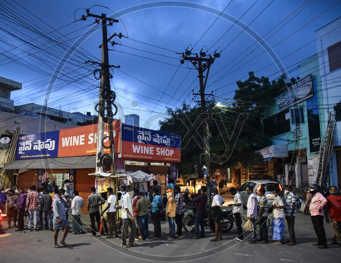 People Wait In A Line To Buy Liquor At A Wine Store, In Vijayawada On August 23, 2020.