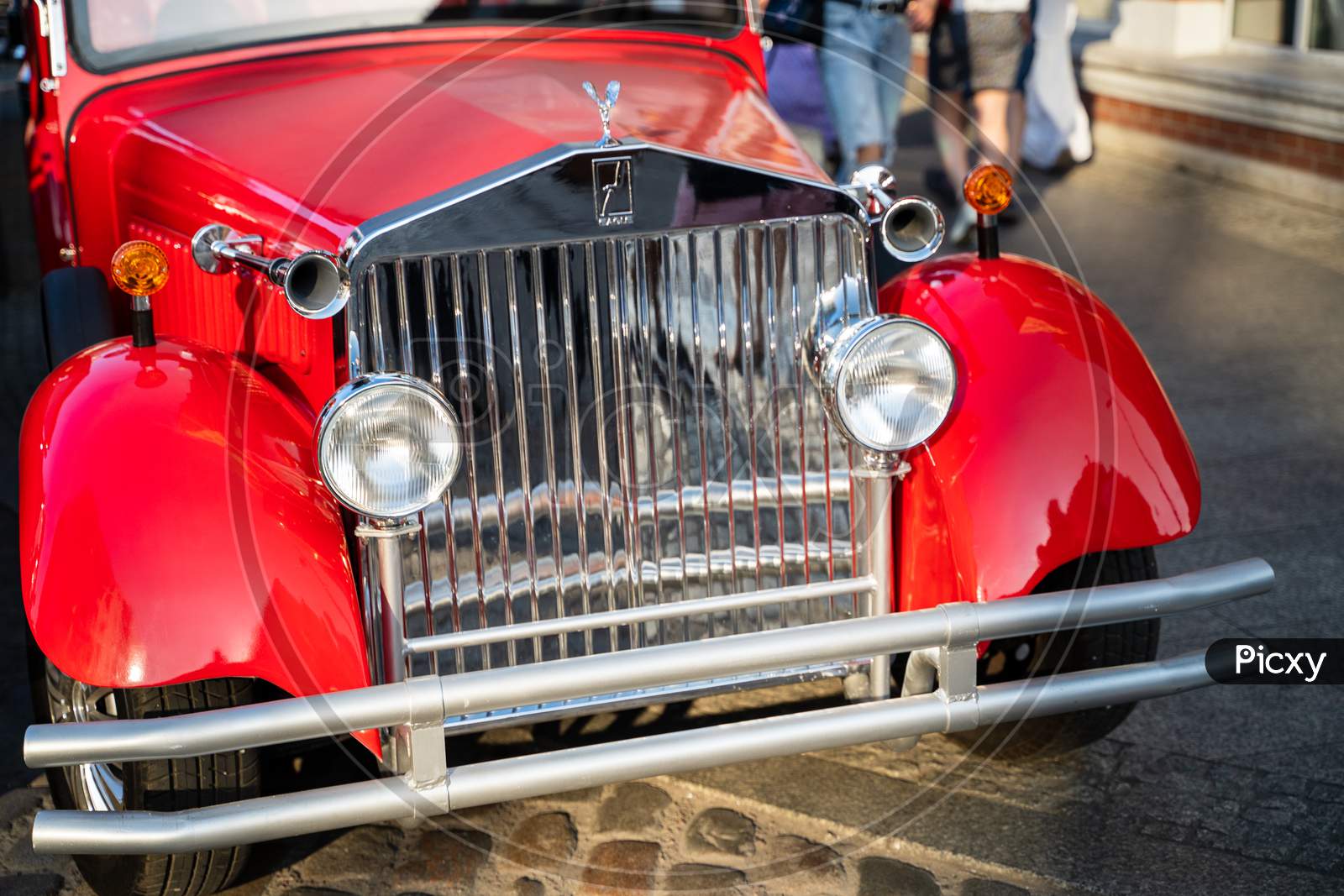 Gdansk, North Poland - August 13, 2020: Close Up Of A Red Vintage Car Front Parked In A City Center Main Square