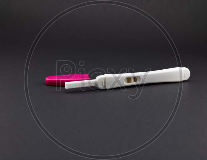 Pink and white pregnancy test