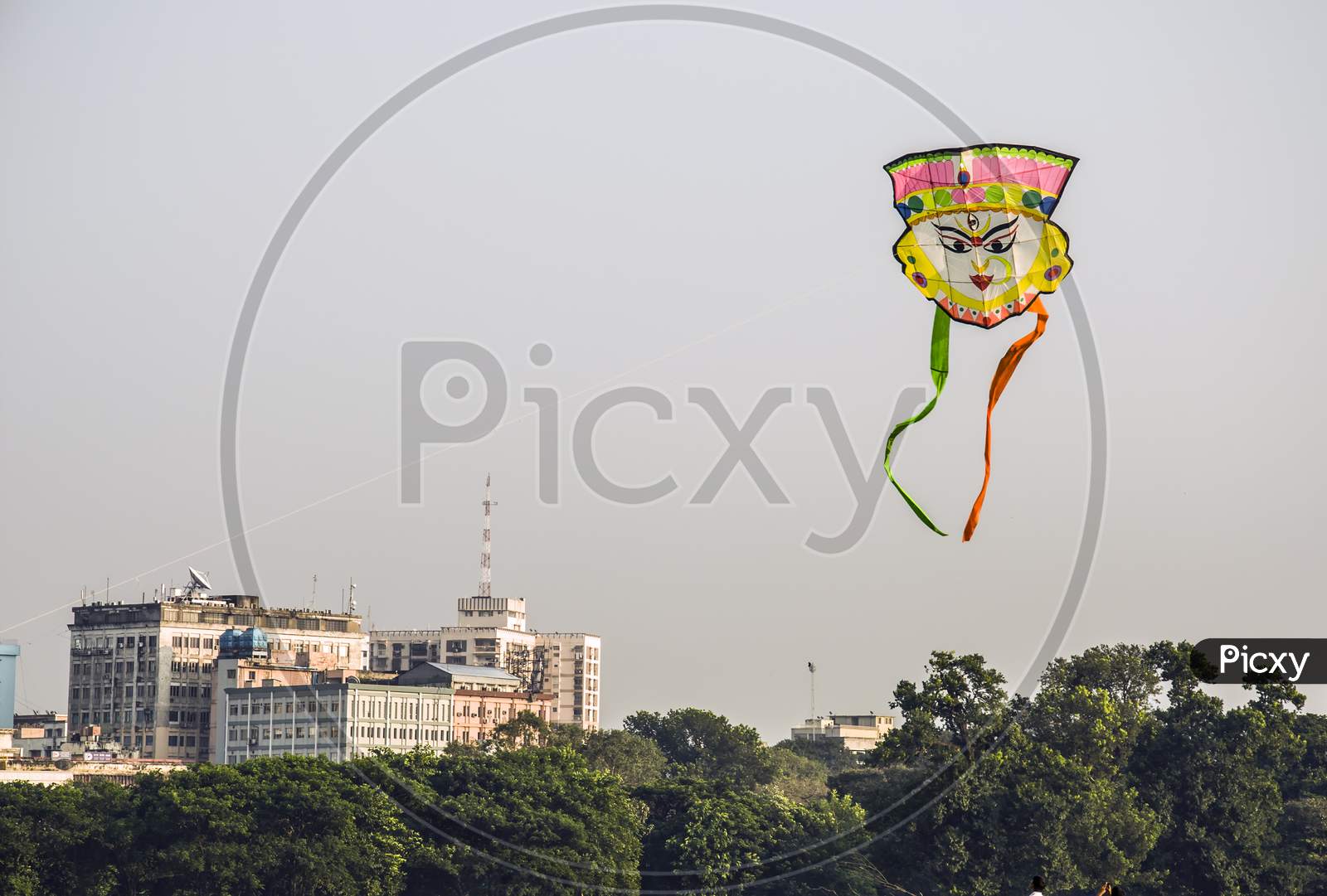 A kite is flying in the city of Kolkata.