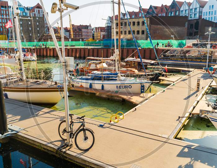 Gdansk, North Poland - August 13, 2020: Bike Parked In A Port Bay Of Ship Yard Near Baltic Sea