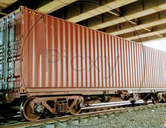 Containers loaded on train wagons on a railway