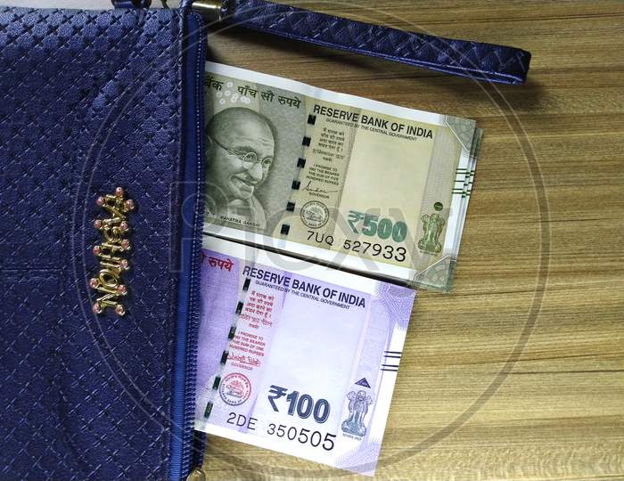 Indian Currency in a Money Purse,100 And 500 Rupee Notes.