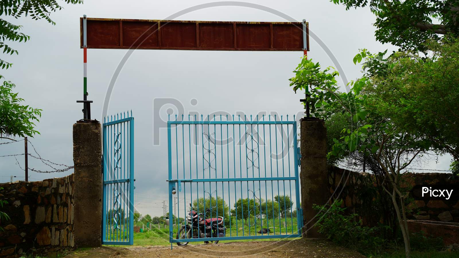 Iron fence gate of School. Empty gate without children.