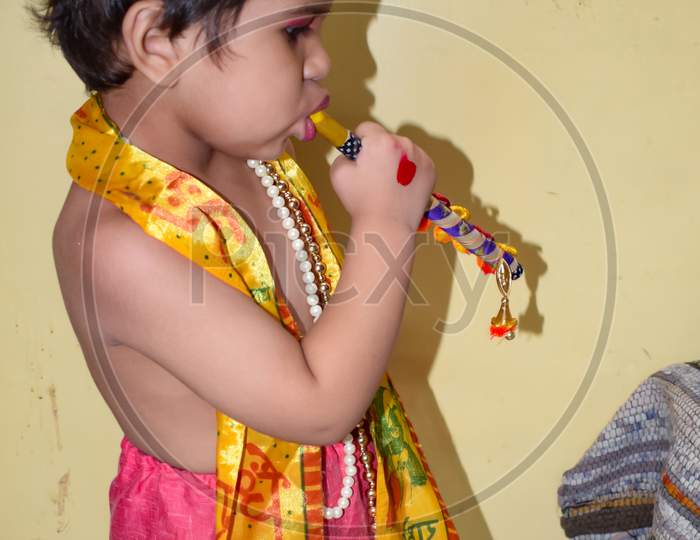 Cute Indian Kid Dressed Up As Little Lord Krishna On The Occasion Of Radha Krishna Janmastami Festival In Delhi India