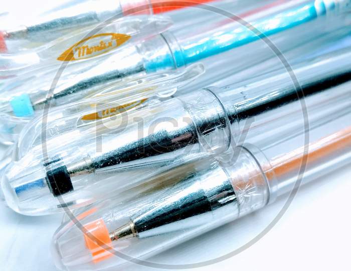 A picture of ink pens on white background