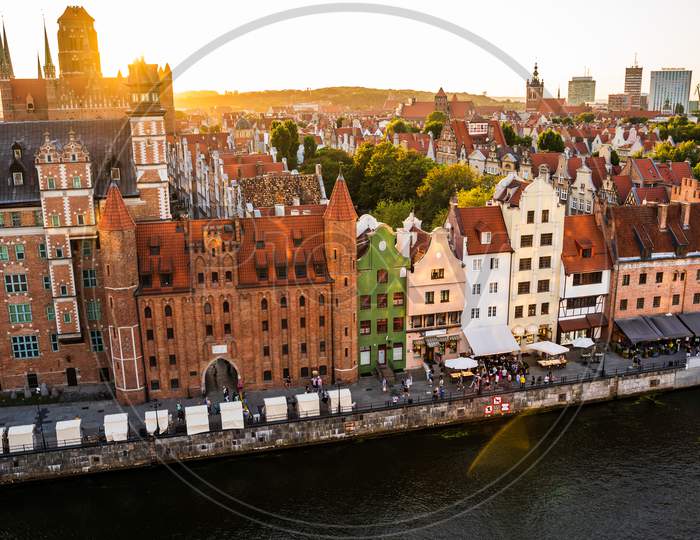 Gdansk, North Poland - August 13, 2020: Gdansk, North Poland - August 13, 2020: Wide Angle Panoramic Aerial Shot Of Motlawa River Embankment In Old Town During Sunset In Summer