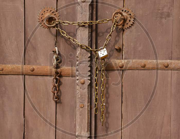 closed wooden door with chain lock