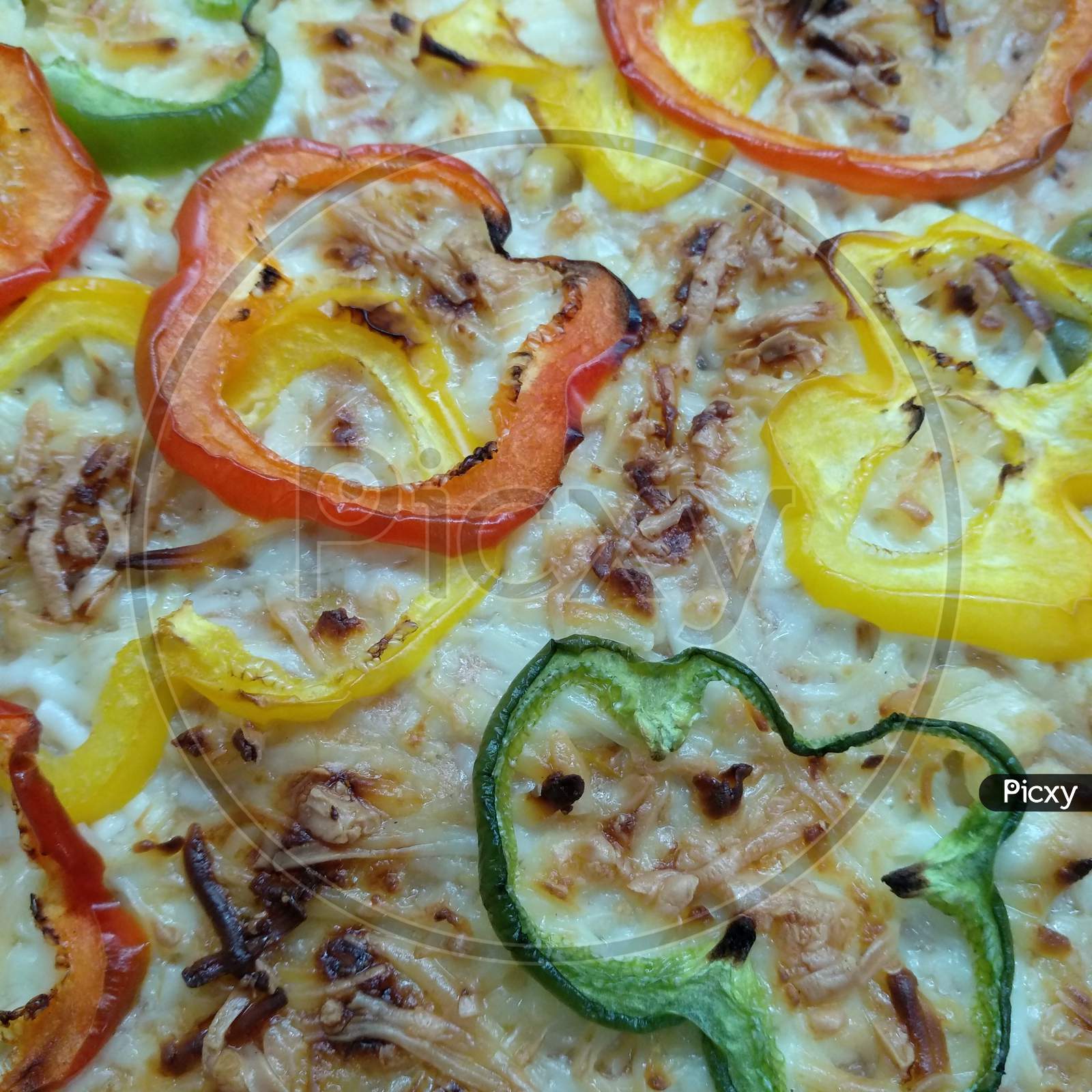 Veg cheese bake dish Closeup photo also look like Pizza