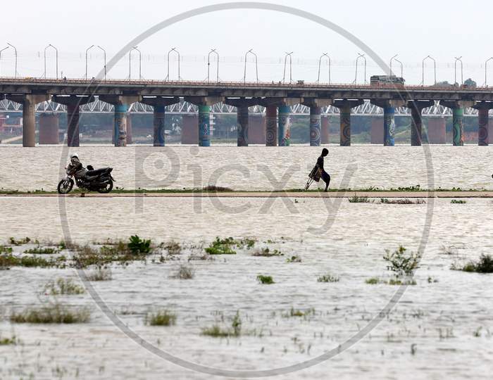 A Man Cross The Flood Water Of River Ganga In Prayagraj, August 29, 2020.