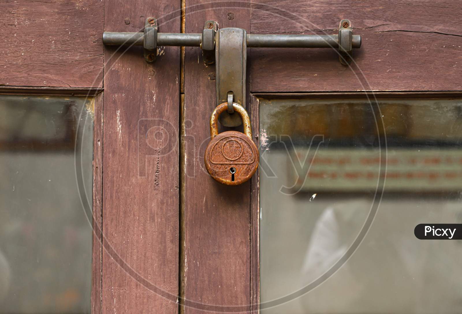 closed wooden door with lock